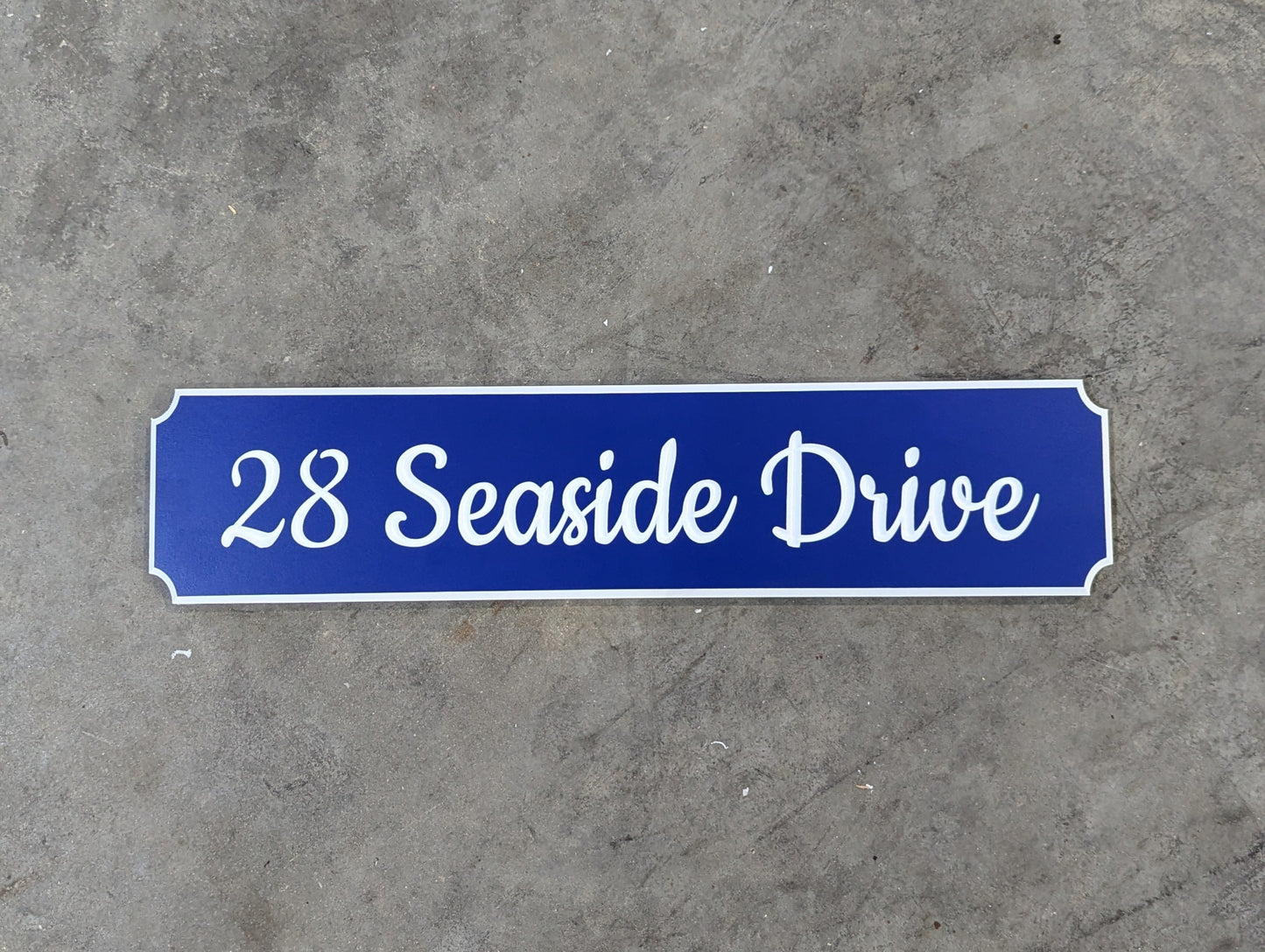 "Seaside drive" street name and number sign