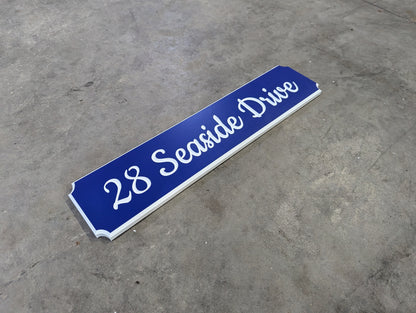 "Seaside drive" street name and number sign